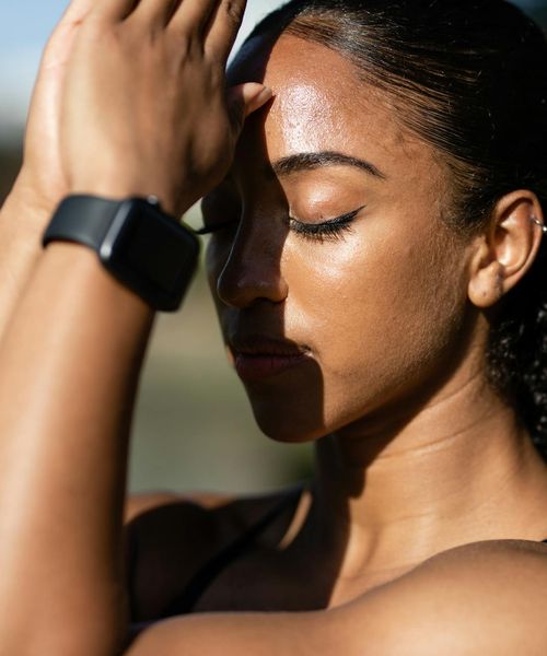 A woman meditating peacefully, symbolizing inner focus and tranquility.