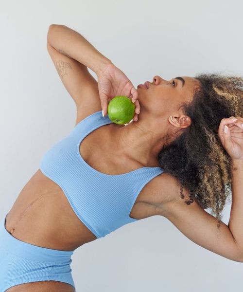 Woman stretching gracefully, representing renewed energy and vitality.